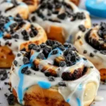 Cookie Monster cinnamon rolls topped with crushed cookies and cream cheese icing Cookie Monster Cinnamon Rolls